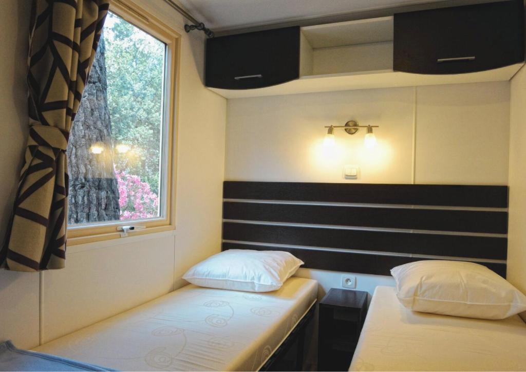 Postel nebo postele na pokoji v ubytování Camping Mulinacciu