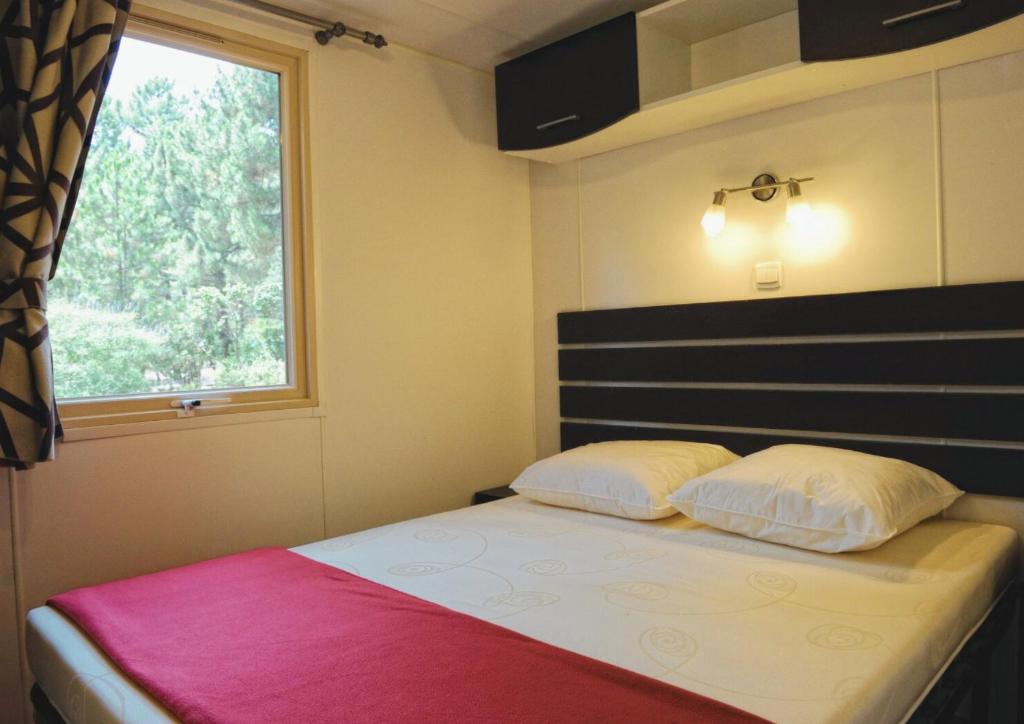 Postel nebo postele na pokoji v ubytování Camping Mulinacciu
