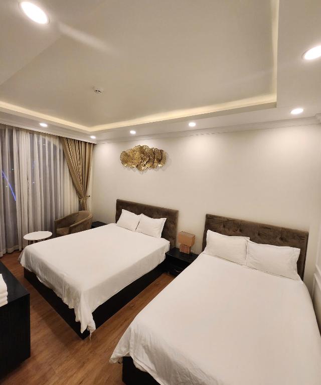Postel nebo postele na pokoji v ubytování BREAKING DAWN- TAEYANG Hotel Phú Quốc