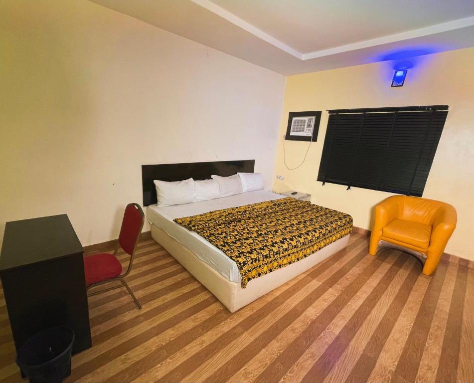 Postel nebo postele na pokoji v ubytování Okeyl Suites