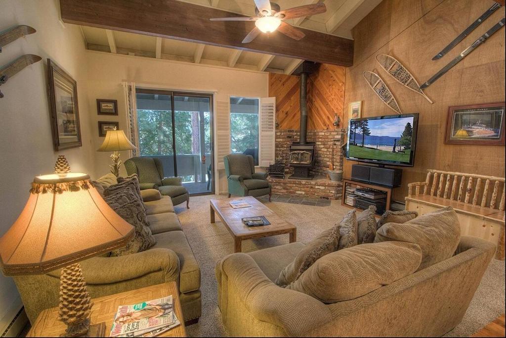 a living room with couches and a flat screen tv at Eagle's Lake Retreat condo in Incline Village