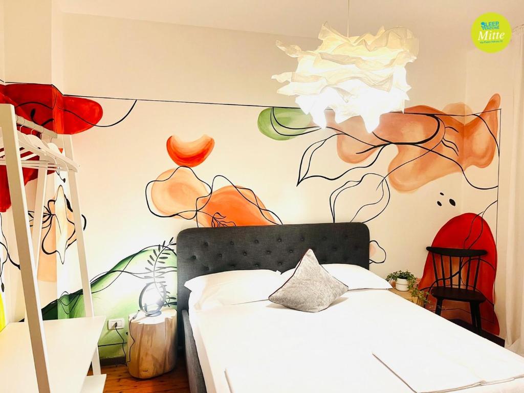 Postel nebo postele na pokoji v ubytování Sleep In Venzone Mitte