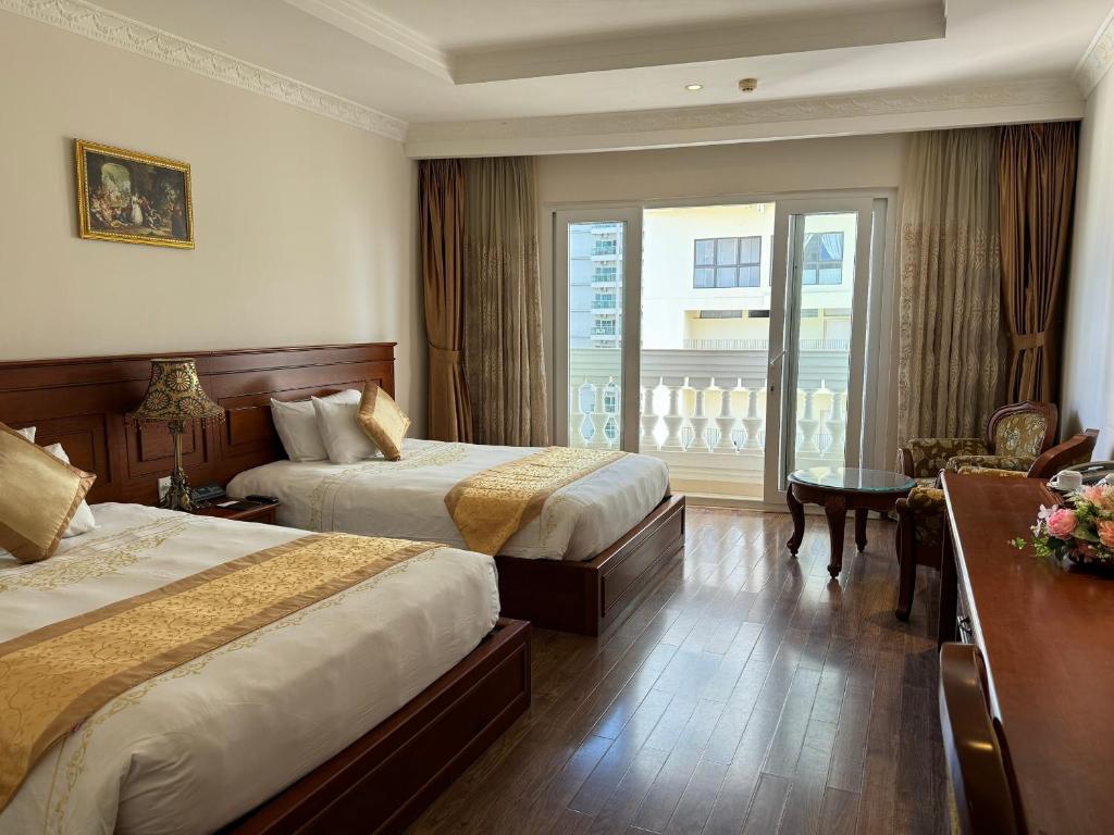 Katil atau katil-katil dalam bilik di Nha Trang Palace Hotel