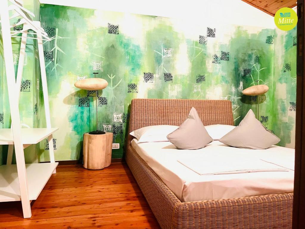 Postel nebo postele na pokoji v ubytování Sleep In Venzone Mitte