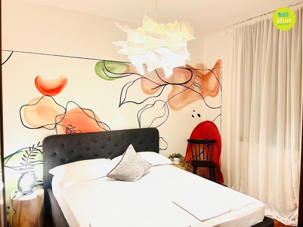Postel nebo postele na pokoji v ubytování Sleep In Venzone Mitte