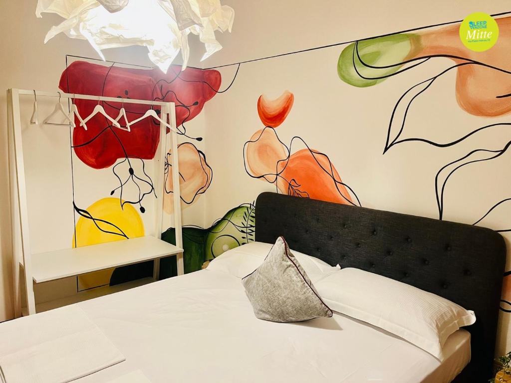 Postel nebo postele na pokoji v ubytování Sleep In Venzone Mitte