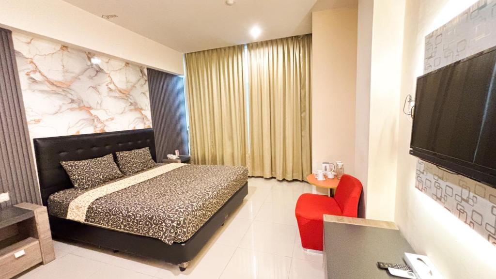 Voodi või voodid majutusasutuse UTC Hotel Semarang toas