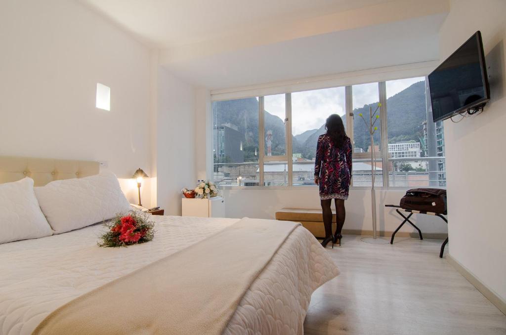 Postel nebo postele na pokoji v ubytování Hotel Inter Bogotá