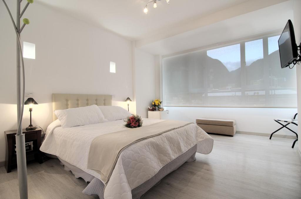 Postel nebo postele na pokoji v ubytování Hotel Inter Bogotá