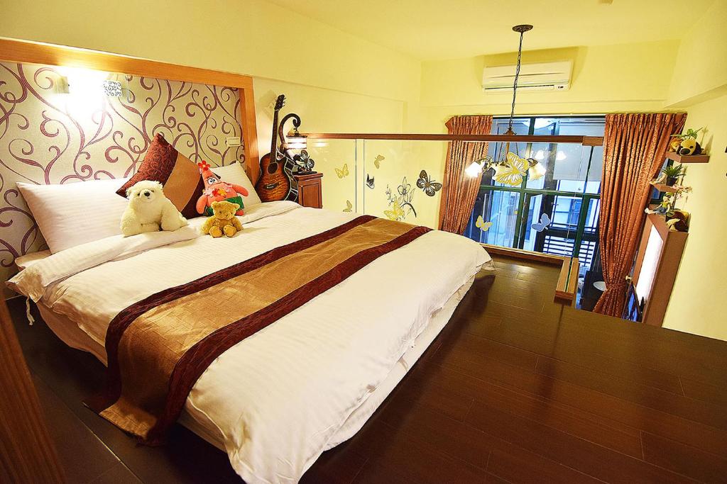 Postel nebo postele na pokoji v ubytování No. 21 Jiaoxi Hot Spring Homestay