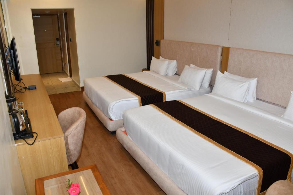 Postel nebo postele na pokoji v ubytování Hotel Oxina Cizel
