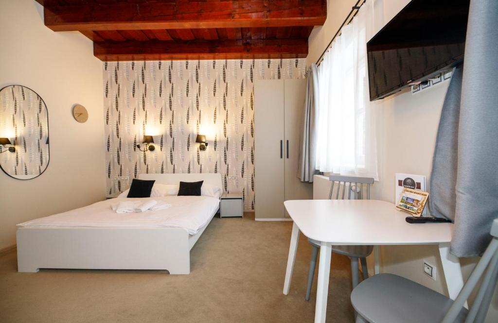 Postel nebo postele na pokoji v ubytování Aparthotel Panorama