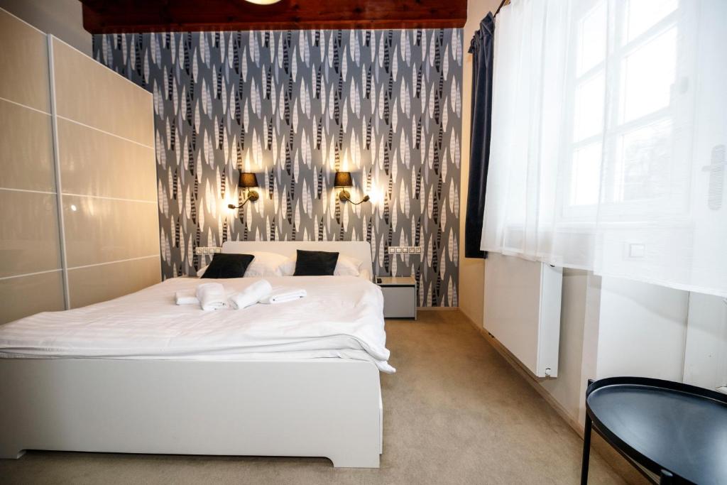 Postel nebo postele na pokoji v ubytování Aparthotel Panorama