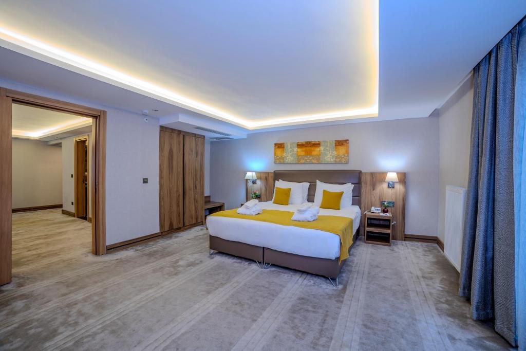 Postel nebo postele na pokoji v ubytování Royal Termal Hotel
