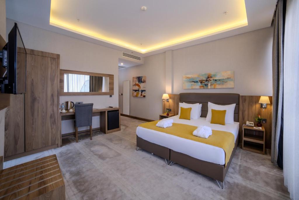 Postel nebo postele na pokoji v ubytování Royal Termal Hotel