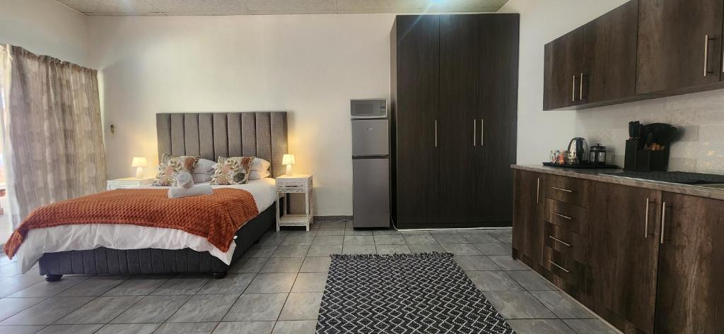 Postel nebo postele na pokoji v ubytování Carrington Guesthouse