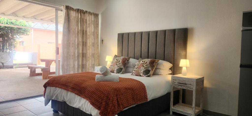Postel nebo postele na pokoji v ubytování Carrington Guesthouse