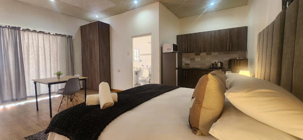 Postel nebo postele na pokoji v ubytování Carrington Guesthouse