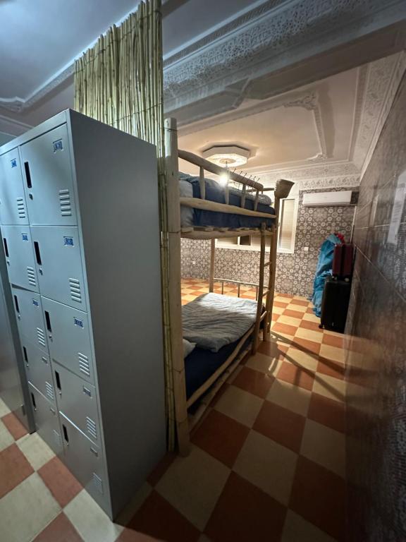 Letto o letti in una camera di DAR SANAE SURF