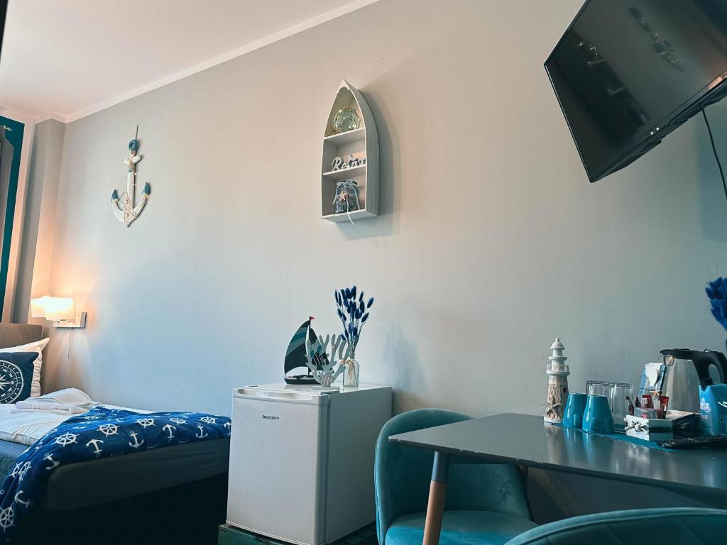 TV a/nebo společenská místnost v ubytování ORCA Hotel am Elbschloss