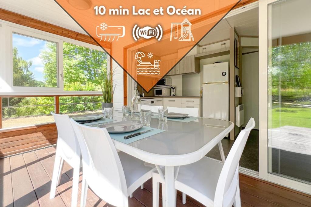une salle à manger avec une table en verre et des chaises blanches dans l'établissement Coin de Paradis Lac et ocean Sans vis à vis, à Hourtin