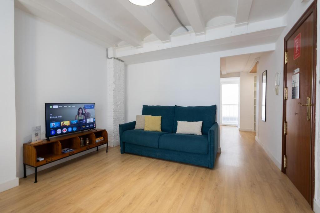 TV a/nebo společenská místnost v ubytování FLORIT FLATS - The Ruzafa Apartment