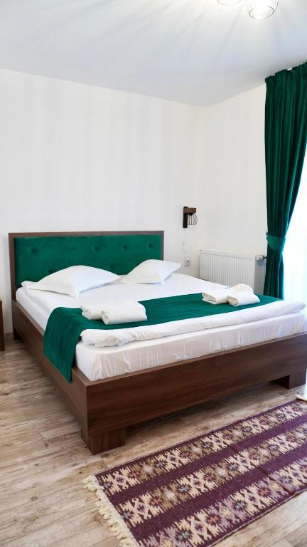 Postel nebo postele na pokoji v ubytování Green Mountain Resort
