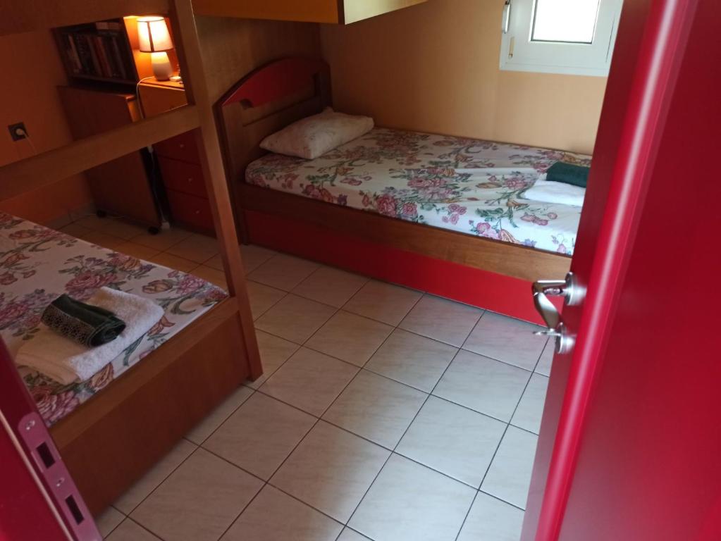 A bed or beds in a room at The Emerald Lopi, 2km from Ammolofoi beach! The best kept secret in nature, of Nea Peramos