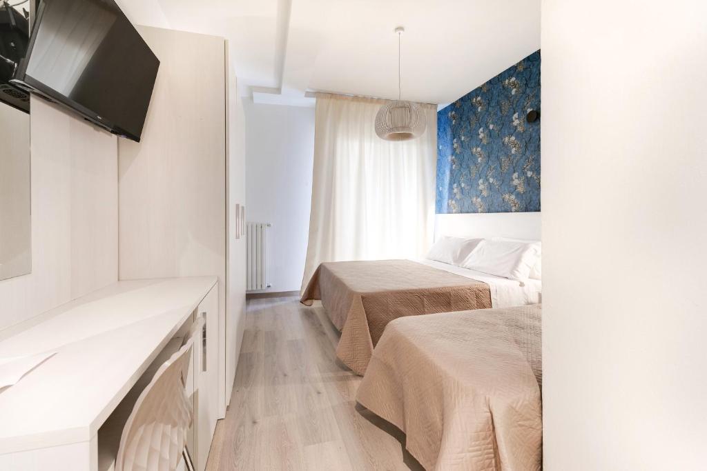 Postel nebo postele na pokoji v ubytování Custodisca Hotel Evolution