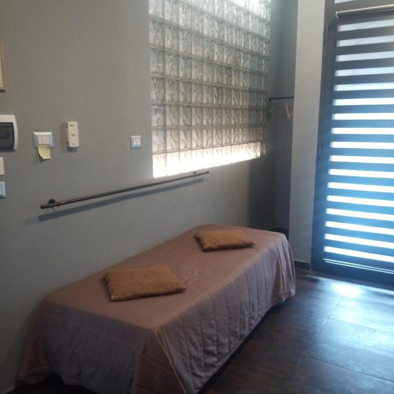 Uma cama ou camas num quarto em MAGIA DI MARE
