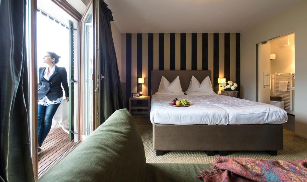 Postel nebo postele na pokoji v ubytování Hotel Chalet Gravenstein