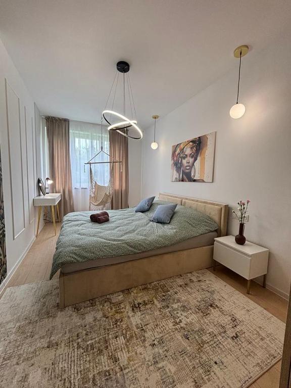 a bedroom with a large bed with a rug at Mieszkanie dla RODZINY 60m2 in Nowa Ruda