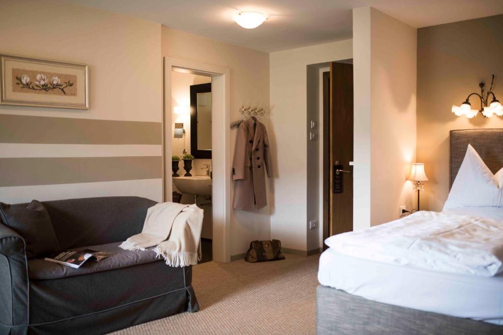 Postel nebo postele na pokoji v ubytování Hotel Chalet Gravenstein