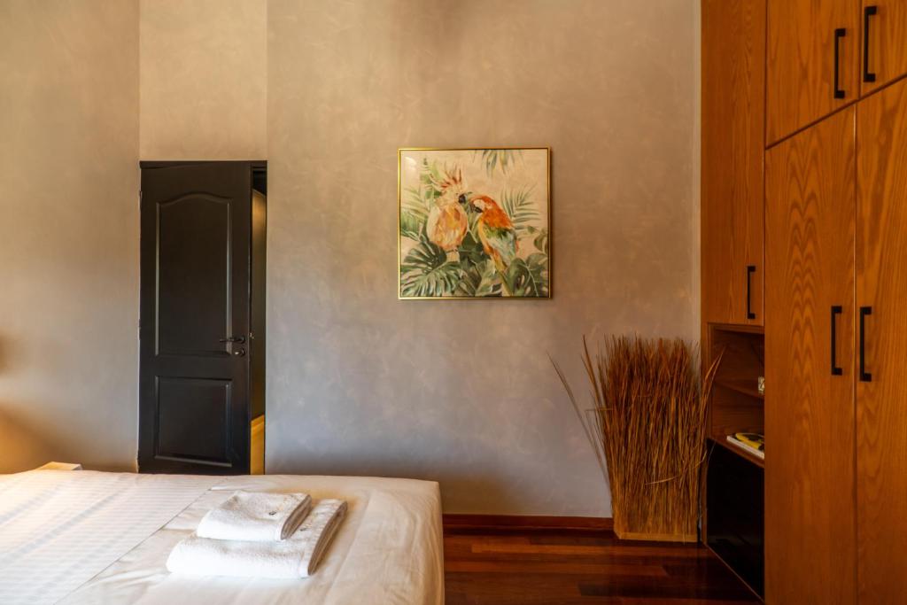 Postel nebo postele na pokoji v ubytování Mimosa Urban Habitation
