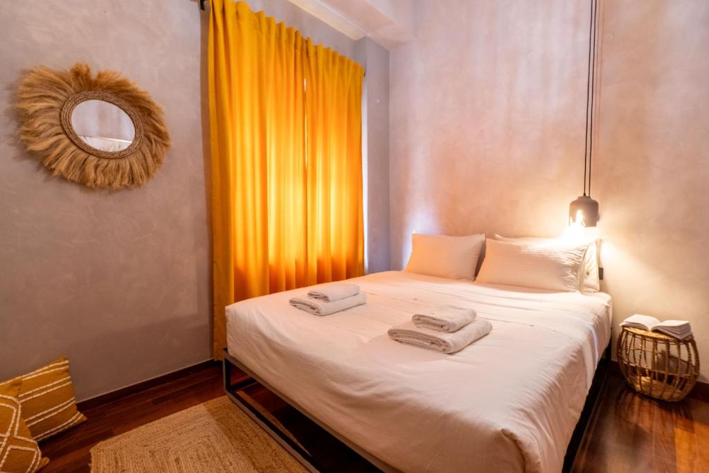 Postel nebo postele na pokoji v ubytování Mimosa Urban Habitation