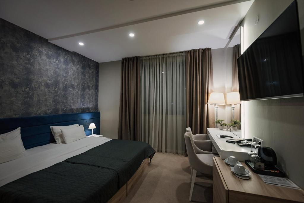 TV a/nebo společenská místnost v ubytování IG Hotel
