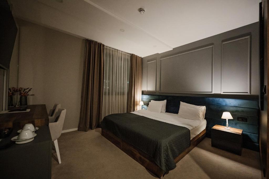 Postel nebo postele na pokoji v ubytování IG Hotel