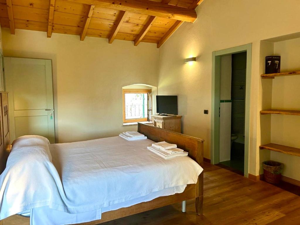 Postel nebo postele na pokoji v ubytování Cascina Girolda