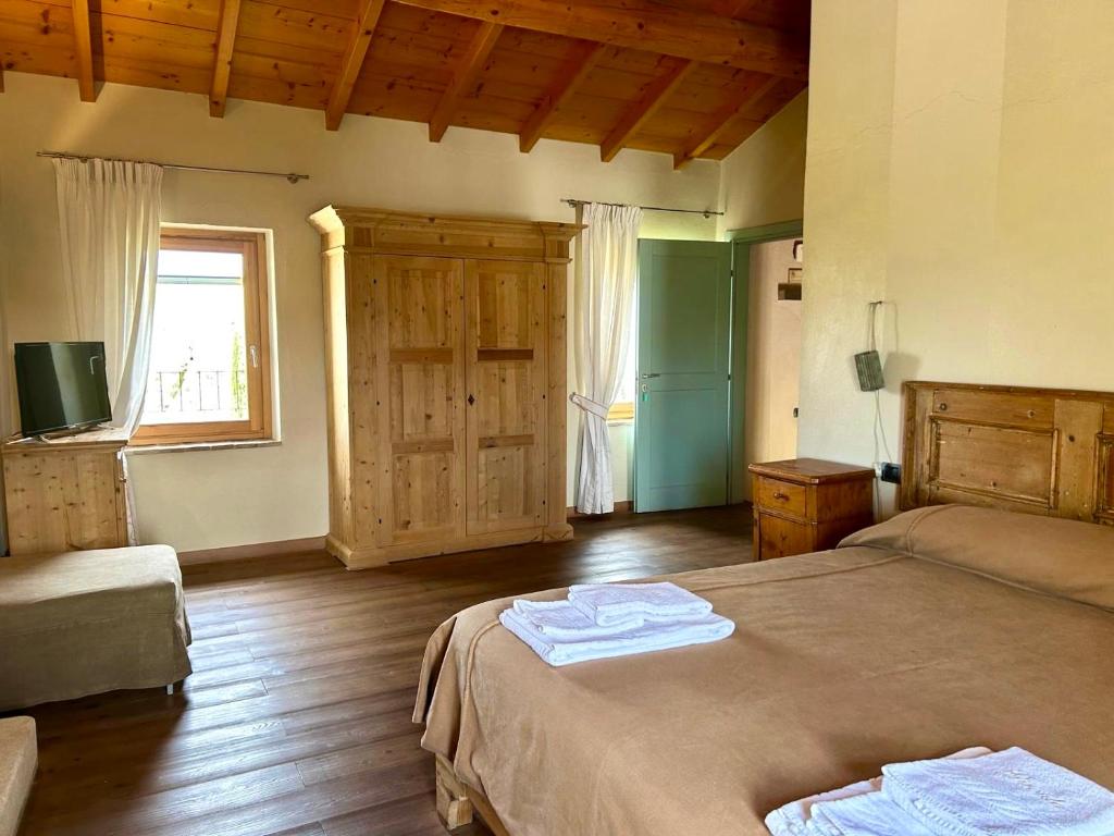Postel nebo postele na pokoji v ubytování Cascina Girolda