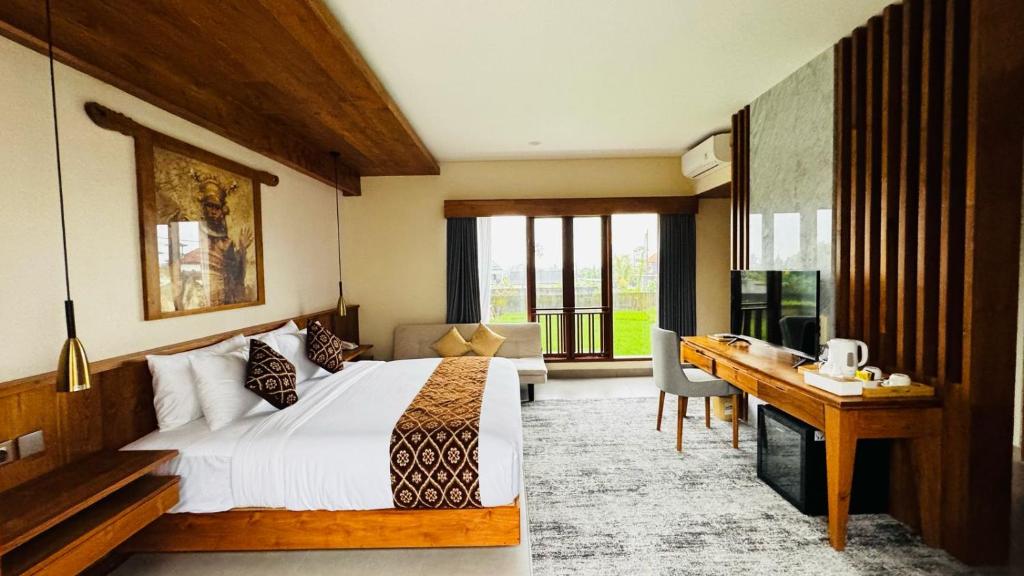 Postel nebo postele na pokoji v ubytování Saraswati Ubud