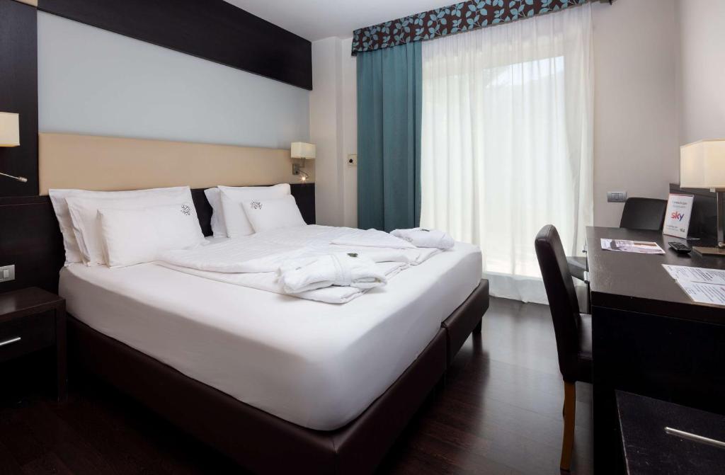 Postel nebo postele na pokoji v ubytování Best Western Hotel Adige