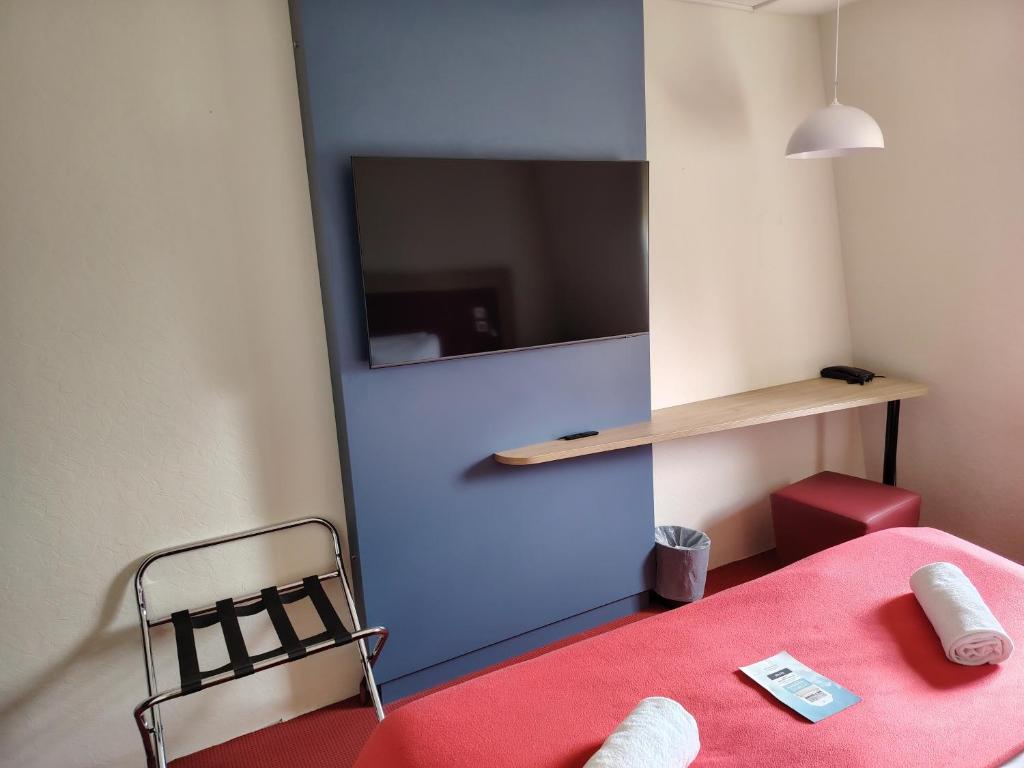 Postel nebo postele na pokoji v ubytování Kyriad Laon