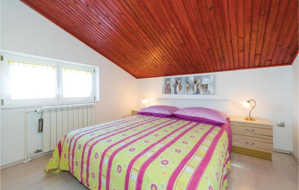 Postel nebo postele na pokoji v ubytování Apartment Augusta Senoe Iv