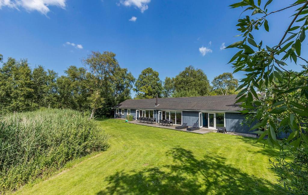 a house with a large yard in front of it at Nice Home In Vejby With Sauna in Vejby