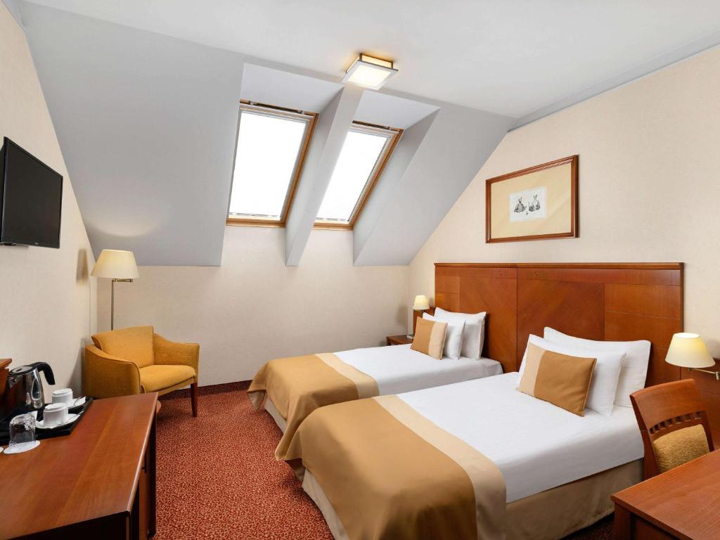 Posteľ alebo postele v izbe v ubytovaní Mercure Szekesfehervar Magyar Kiraly