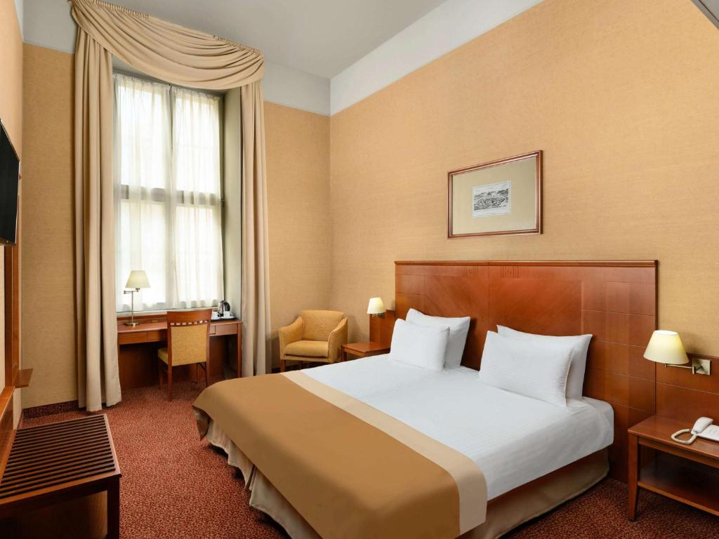 Posteľ alebo postele v izbe v ubytovaní Mercure Szekesfehervar Magyar Kiraly