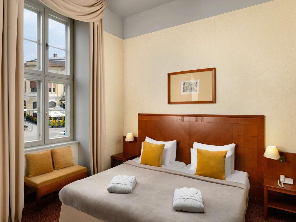 Posteľ alebo postele v izbe v ubytovaní Mercure Szekesfehervar Magyar Kiraly