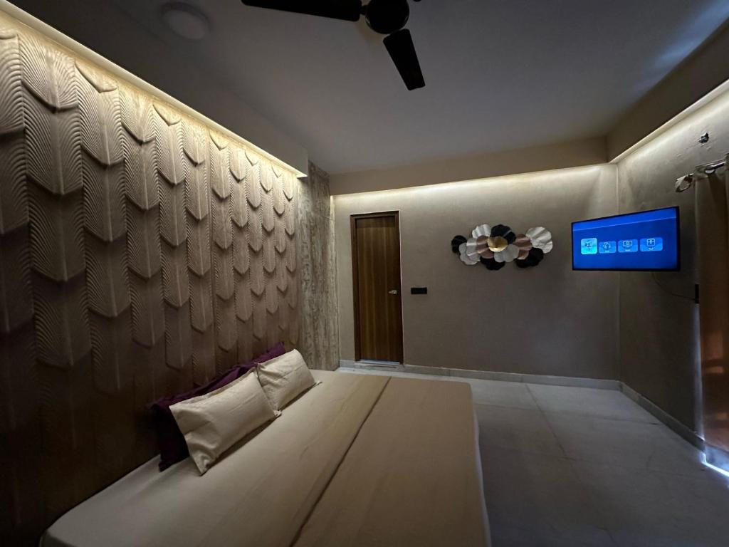 Postel nebo postele na pokoji v ubytování Desire Courtyard