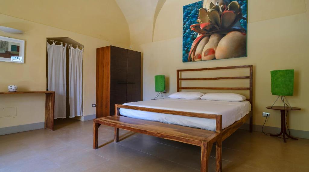 Łóżko lub łóżka w pokoju w obiekcie Masseria Bernardini by Symphonya Luxury Rentals