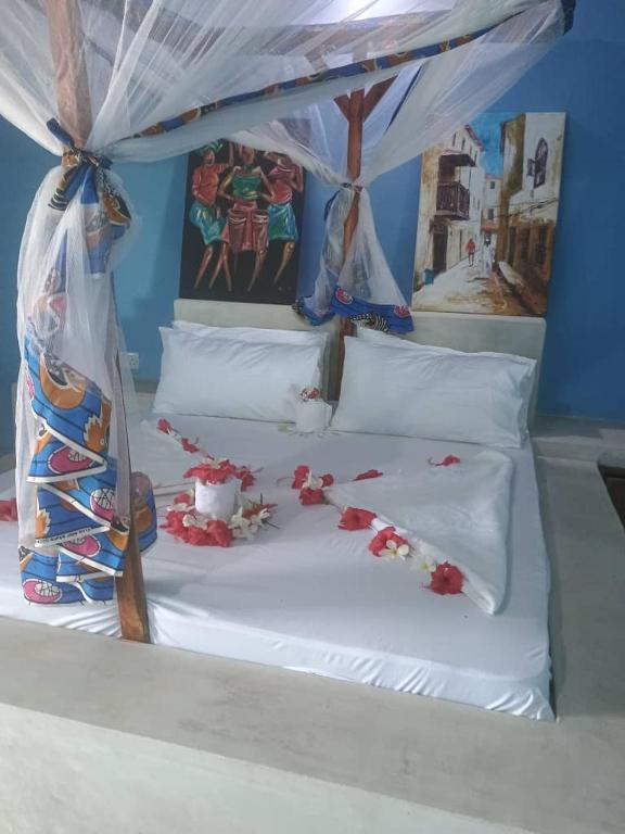 Postel nebo postele na pokoji v ubytování Msafiri House